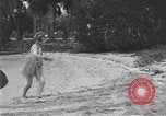 Image of Boy dressed in grass skirt performs hula dance Fort Lauderdale Florida USA, 1920, second 14 stock footage video 65675076871