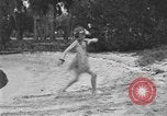 Image of Boy dressed in grass skirt performs hula dance Fort Lauderdale Florida USA, 1920, second 15 stock footage video 65675076871