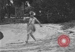 Image of Boy dressed in grass skirt performs hula dance Fort Lauderdale Florida USA, 1920, second 16 stock footage video 65675076871