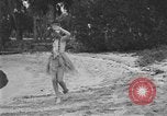 Image of Boy dressed in grass skirt performs hula dance Fort Lauderdale Florida USA, 1920, second 17 stock footage video 65675076871