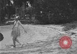 Image of Boy dressed in grass skirt performs hula dance Fort Lauderdale Florida USA, 1920, second 18 stock footage video 65675076871