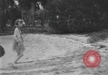 Image of Boy dressed in grass skirt performs hula dance Fort Lauderdale Florida USA, 1920, second 19 stock footage video 65675076871