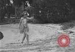 Image of Boy dressed in grass skirt performs hula dance Fort Lauderdale Florida USA, 1920, second 20 stock footage video 65675076871