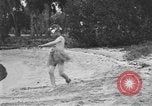 Image of Boy dressed in grass skirt performs hula dance Fort Lauderdale Florida USA, 1920, second 22 stock footage video 65675076871