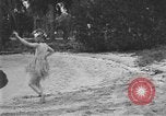 Image of Boy dressed in grass skirt performs hula dance Fort Lauderdale Florida USA, 1920, second 25 stock footage video 65675076871
