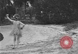 Image of Boy dressed in grass skirt performs hula dance Fort Lauderdale Florida USA, 1920, second 26 stock footage video 65675076871