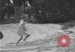 Image of Boy dressed in grass skirt performs hula dance Fort Lauderdale Florida USA, 1920, second 27 stock footage video 65675076871