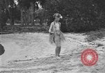 Image of Boy dressed in grass skirt performs hula dance Fort Lauderdale Florida USA, 1920, second 28 stock footage video 65675076871