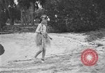 Image of Boy dressed in grass skirt performs hula dance Fort Lauderdale Florida USA, 1920, second 29 stock footage video 65675076871