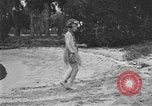 Image of Boy dressed in grass skirt performs hula dance Fort Lauderdale Florida USA, 1920, second 30 stock footage video 65675076871