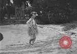 Image of Boy dressed in grass skirt performs hula dance Fort Lauderdale Florida USA, 1920, second 31 stock footage video 65675076871