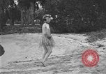 Image of Boy dressed in grass skirt performs hula dance Fort Lauderdale Florida USA, 1920, second 32 stock footage video 65675076871