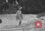 Image of Boy dressed in grass skirt performs hula dance Fort Lauderdale Florida USA, 1920, second 35 stock footage video 65675076871