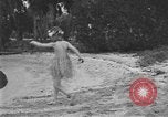 Image of Boy dressed in grass skirt performs hula dance Fort Lauderdale Florida USA, 1920, second 36 stock footage video 65675076871