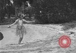 Image of Boy dressed in grass skirt performs hula dance Fort Lauderdale Florida USA, 1920, second 38 stock footage video 65675076871