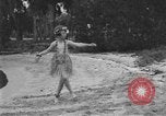 Image of Boy dressed in grass skirt performs hula dance Fort Lauderdale Florida USA, 1920, second 39 stock footage video 65675076871