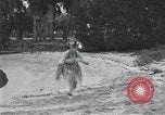 Image of Boy dressed in grass skirt performs hula dance Fort Lauderdale Florida USA, 1920, second 40 stock footage video 65675076871