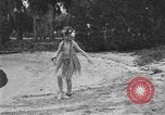Image of Boy dressed in grass skirt performs hula dance Fort Lauderdale Florida USA, 1920, second 41 stock footage video 65675076871