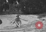 Image of Boy dressed in grass skirt performs hula dance Fort Lauderdale Florida USA, 1920, second 42 stock footage video 65675076871