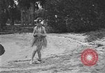 Image of Boy dressed in grass skirt performs hula dance Fort Lauderdale Florida USA, 1920, second 43 stock footage video 65675076871