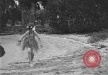 Image of Boy dressed in grass skirt performs hula dance Fort Lauderdale Florida USA, 1920, second 45 stock footage video 65675076871