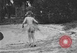 Image of Boy dressed in grass skirt performs hula dance Fort Lauderdale Florida USA, 1920, second 46 stock footage video 65675076871