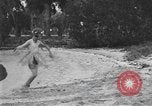 Image of Boy dressed in grass skirt performs hula dance Fort Lauderdale Florida USA, 1920, second 47 stock footage video 65675076871
