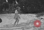 Image of Boy dressed in grass skirt performs hula dance Fort Lauderdale Florida USA, 1920, second 48 stock footage video 65675076871