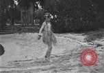 Image of Boy dressed in grass skirt performs hula dance Fort Lauderdale Florida USA, 1920, second 49 stock footage video 65675076871