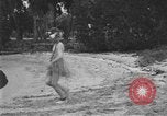 Image of Boy dressed in grass skirt performs hula dance Fort Lauderdale Florida USA, 1920, second 50 stock footage video 65675076871