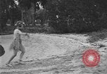 Image of Boy dressed in grass skirt performs hula dance Fort Lauderdale Florida USA, 1920, second 51 stock footage video 65675076871