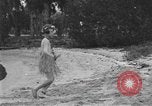 Image of Boy dressed in grass skirt performs hula dance Fort Lauderdale Florida USA, 1920, second 52 stock footage video 65675076871