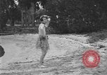 Image of Boy dressed in grass skirt performs hula dance Fort Lauderdale Florida USA, 1920, second 53 stock footage video 65675076871