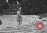 Image of Boy dressed in grass skirt performs hula dance Fort Lauderdale Florida USA, 1920, second 54 stock footage video 65675076871