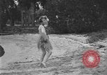 Image of Boy dressed in grass skirt performs hula dance Fort Lauderdale Florida USA, 1920, second 55 stock footage video 65675076871