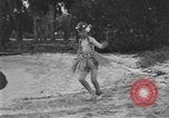 Image of Boy dressed in grass skirt performs hula dance Fort Lauderdale Florida USA, 1920, second 56 stock footage video 65675076871