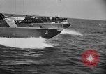 Image of landing boats United States USA, 1944, second 43 stock footage video 65675077220