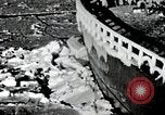 Image of USS Burton Island breaking way through ice in Bering Sea Bering Sea, 1952, second 6 stock footage video 65675077436