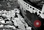 Image of USS Burton Island breaking way through ice in Bering Sea Bering Sea, 1952, second 8 stock footage video 65675077436