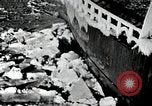 Image of USS Burton Island breaking way through ice in Bering Sea Bering Sea, 1952, second 9 stock footage video 65675077436