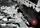 Image of USS Burton Island breaking way through ice in Bering Sea Bering Sea, 1952, second 10 stock footage video 65675077436