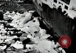 Image of USS Burton Island breaking way through ice in Bering Sea Bering Sea, 1952, second 12 stock footage video 65675077436