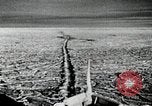 Image of USS Burton Island breaking way through ice in Bering Sea Bering Sea, 1952, second 13 stock footage video 65675077436