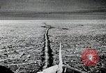 Image of USS Burton Island breaking way through ice in Bering Sea Bering Sea, 1952, second 15 stock footage video 65675077436