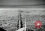 Image of USS Burton Island breaking way through ice in Bering Sea Bering Sea, 1952, second 16 stock footage video 65675077436