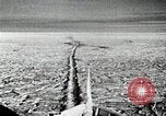 Image of USS Burton Island breaking way through ice in Bering Sea Bering Sea, 1952, second 17 stock footage video 65675077436