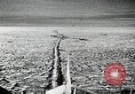 Image of USS Burton Island breaking way through ice in Bering Sea Bering Sea, 1952, second 18 stock footage video 65675077436
