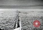 Image of USS Burton Island breaking way through ice in Bering Sea Bering Sea, 1952, second 19 stock footage video 65675077436