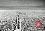 Image of USS Burton Island breaking way through ice in Bering Sea Bering Sea, 1952, second 20 stock footage video 65675077436