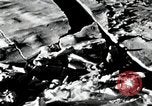Image of USS Burton Island breaking way through ice in Bering Sea Bering Sea, 1952, second 21 stock footage video 65675077436